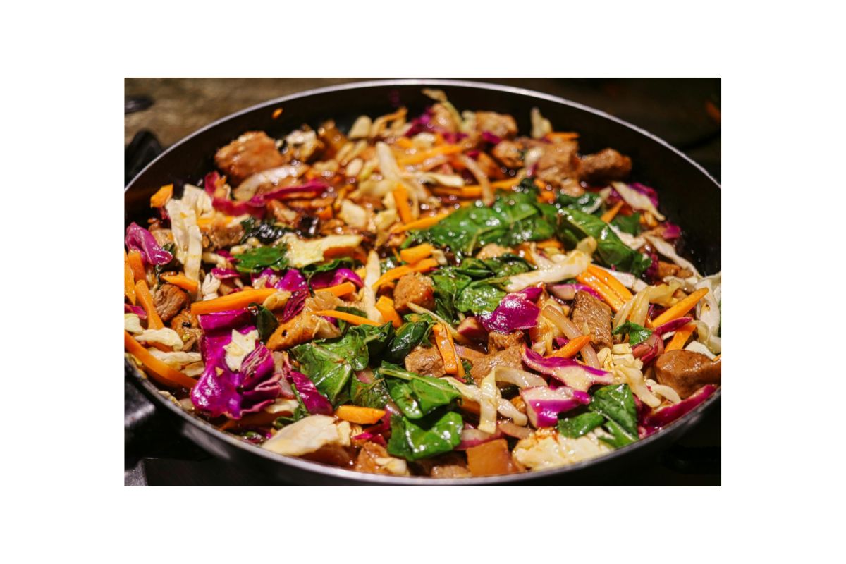 Stir-fried beef with colorful vegetables in a skillet